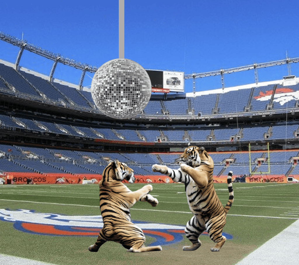 two tigers dancing under a disco ball in the empower broncos football stadium
